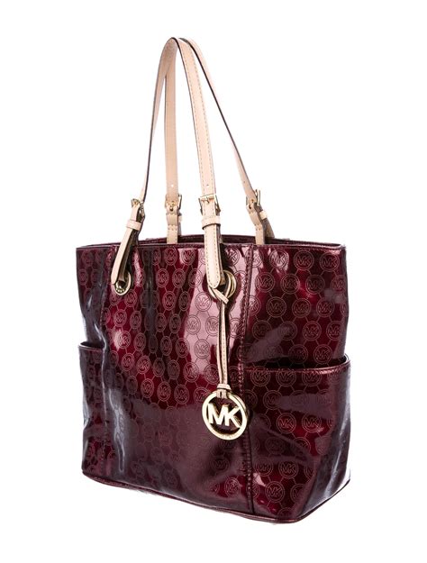 are michael kors purses leather - Michael Kors handbag with lock.